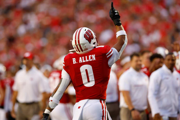 Wisconsin running back Braelon Allen pointing to the sky to honor former running backs coach Gary Brown.